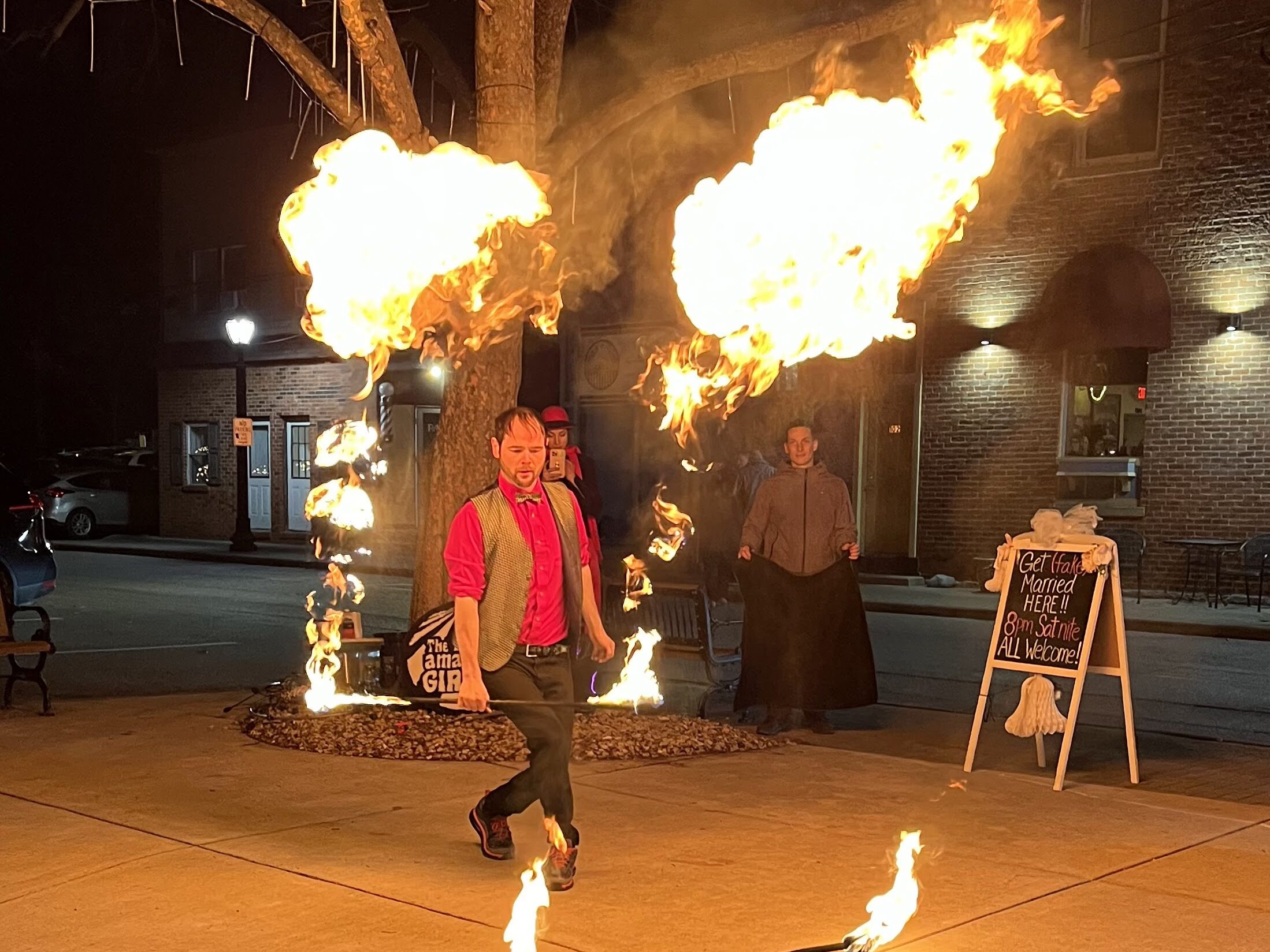 Fire breathing performer entertaining crowds